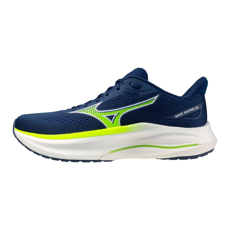 Navy and green running shoe on a white background